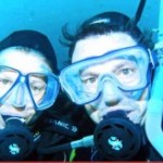 Outdoor girl and her guy dive below the salt pier (video!)